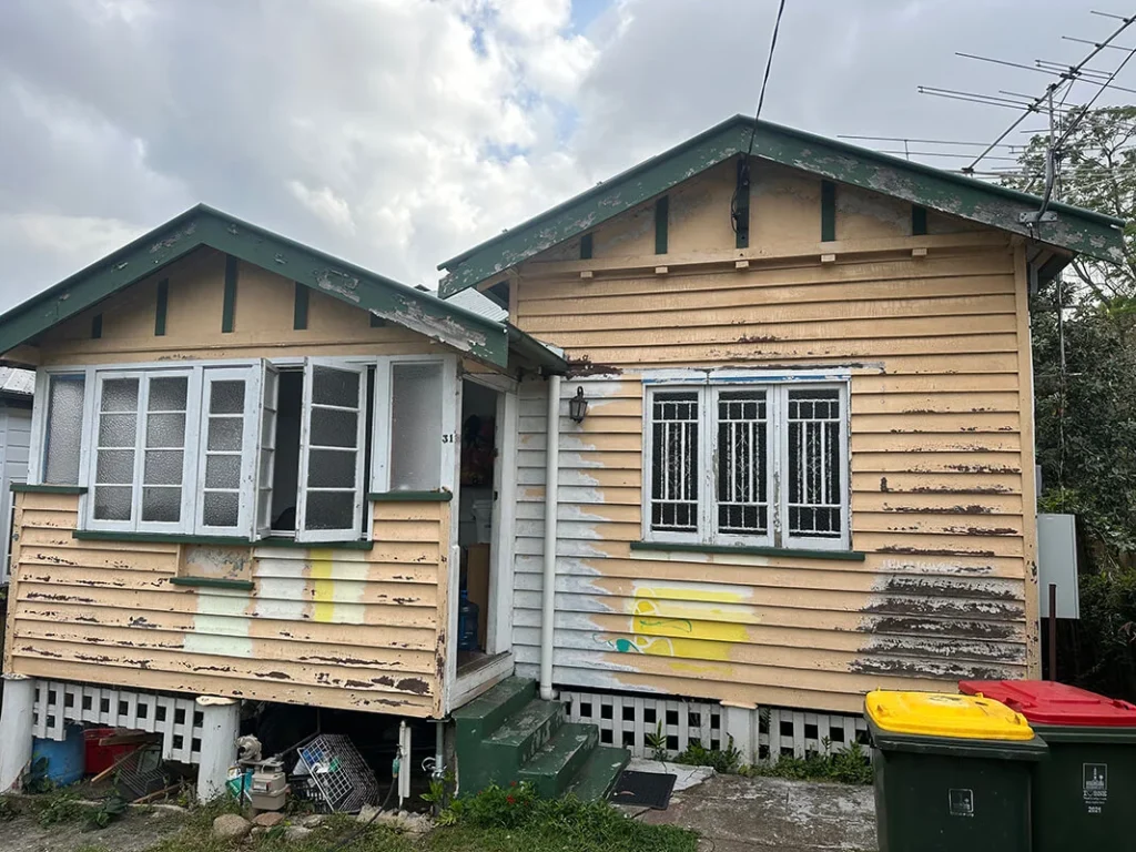 Exterior house painting preparation of old Queenslander home