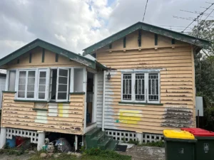 Exterior house painting preparation of old Queenslander home